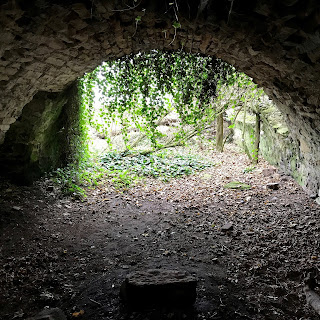 A photograph of the arched stone basement of Auldhame Castle.  Photo by Kevin Nosferatu for the Skulferatu Project.