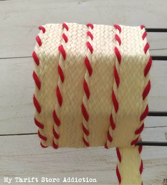 Run to the dollar store to grab a candy cane wire form so you can create one of these farmhouse style wreaths! DIY dollar store candy cane wreath