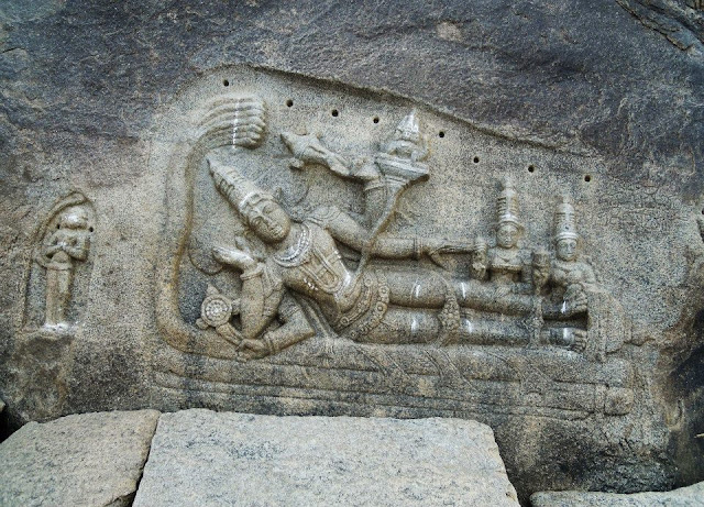 Tock-cut image of Vishnu on the banks of the Tungabhadra river, Hampi.