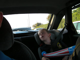 sleeping in the car, tired boy