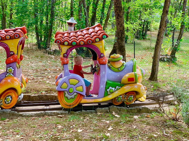 A small children's train ride at a theme park in Dordogne France