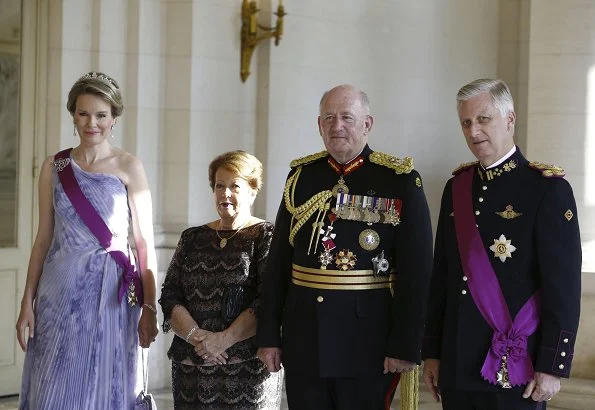 Queen Mathilde wore Natan Couture floral dress, Maison Natan dress, and Aramani blue one shoulder silk dress. Queen Fabiola's Wolfers tiara