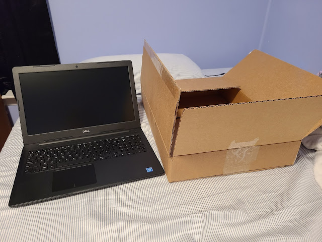 New Dell laptop shipped from Amazon cardboard box Cyber Monday 2020