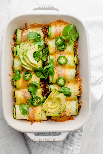 Zucchini Enchiladas - Swap the tortillas for thinly sliced zucchini, and try this low carb keto friendly Zucchini Enchiladas. They're made w/ shredded chicken and sure to impress! Zucchini Enchiladas - Swap the tortillas for thinly sliced zucchini, and try this low carb keto friendly Zucchini Enchiladas. They're made w/ shredded chicken and sure to impress!
