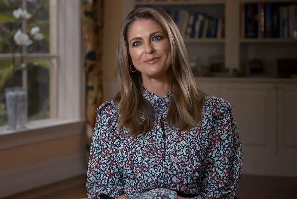 Princess Madeleine wore a wild blossom dress from By Malina, and pyramid hoops earrings from Sophie by Sophie, and rockstud espadrille from Valentino