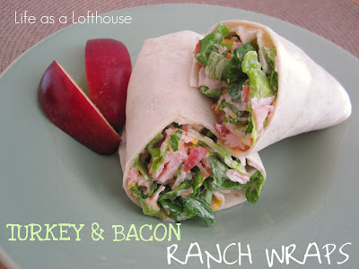 These Turkey & Bacon Ranch Wraps are packed full of crunchy fresh romaine lettuce, sliced turkey, crumbled bacon, tomatoes and ranch dressing. Life-in-the-Lofthouse.com