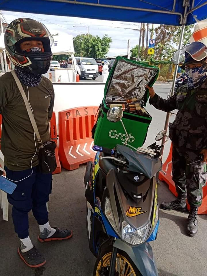 GrabFood rider carrying alcoholic drinks nabbed in a checkpoint Where