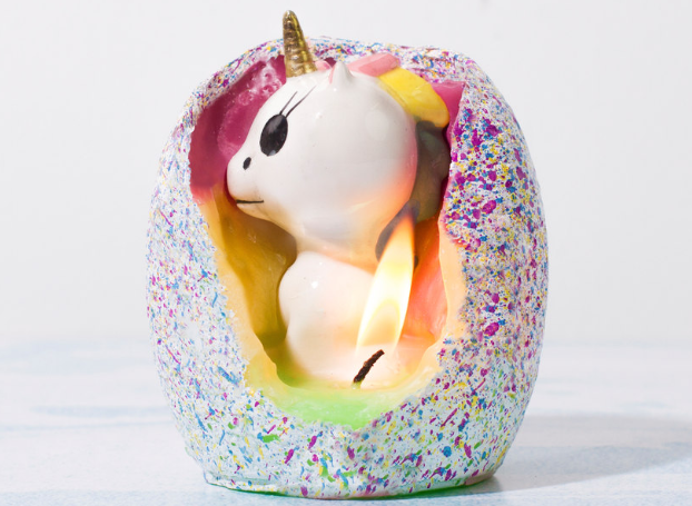 a unicorn hatching out of a candle