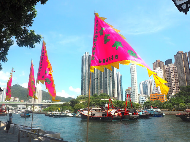 Flags on the promenade by the harbour in Aberdeen, Hong Kong