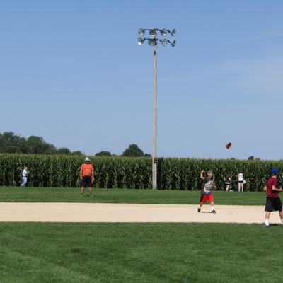 Visitors  playing pick-up baseball on the Field of Dreams