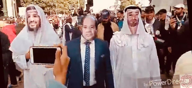 بالفيديو...السيسي يتوسط سلمان وال مكثوم وترامب وبيريز يراقبونهم من الخلف في مسيرة الشعب المغربي ضد "صفقة القرن"