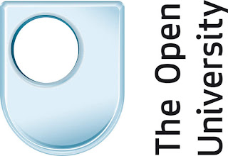 The Open University, a blue shield shaped logo with a round hole offset to the top left and wording running bottom to top on the right hand side.