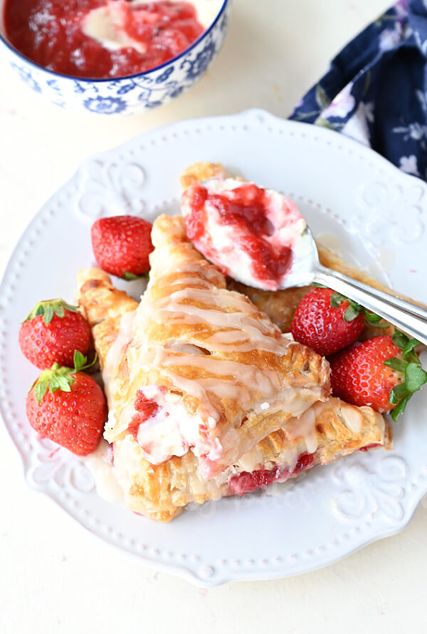 a white plate with best and easy strawberry turnovers