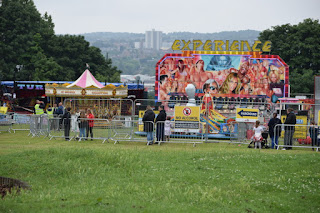 A growing queue of families waiting for the funfair to open