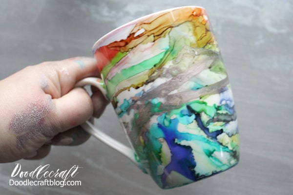 Use Alcohol inks to create a stunning work of abstract art on a ceramic mug for the perfect holiday gift. With full video tutorial instructions too!