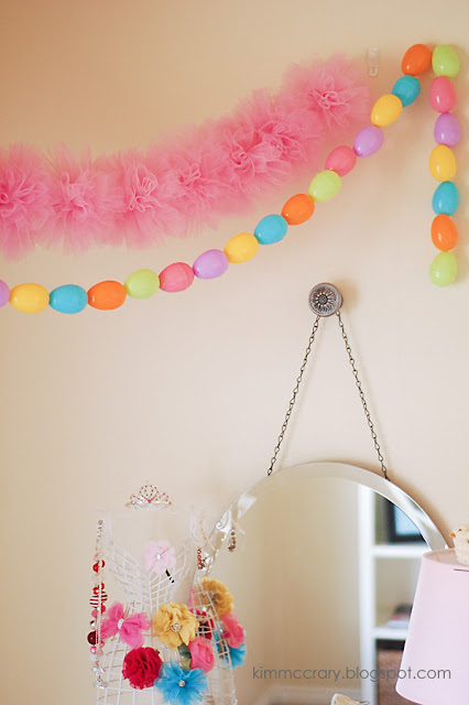 String simple DIY tulle pom poms together to create a pretty garland for any celebration. 