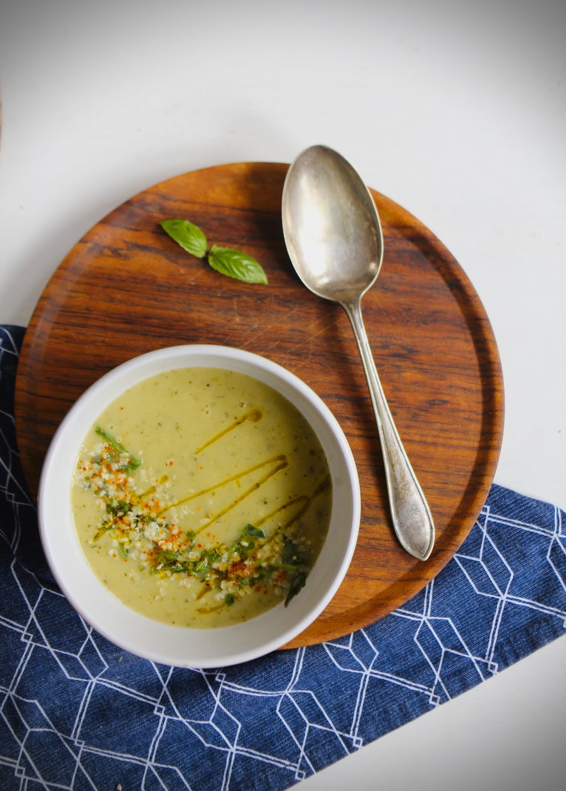 Creamy courgette and white bean soup with roasted garlic and basil