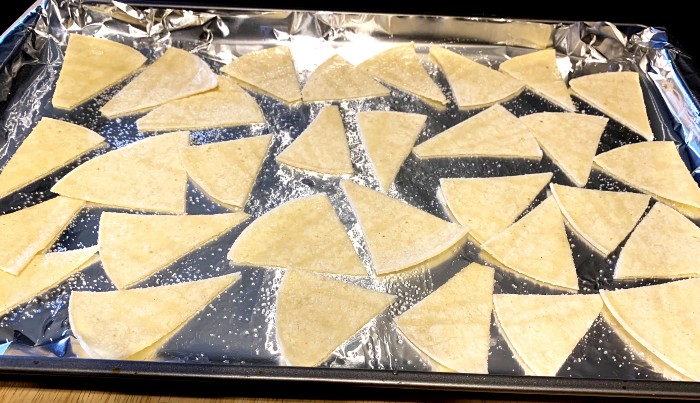 Tortilla chips on baking sheet