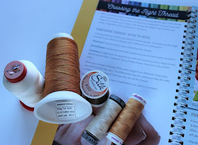 a variety of threads for different sewing uses
