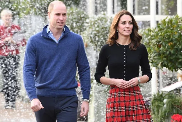 Kate Middleton wore Emilia Wickstead tartan pleated skirt. The Duchess wore a new cashmere cardigan by Brora