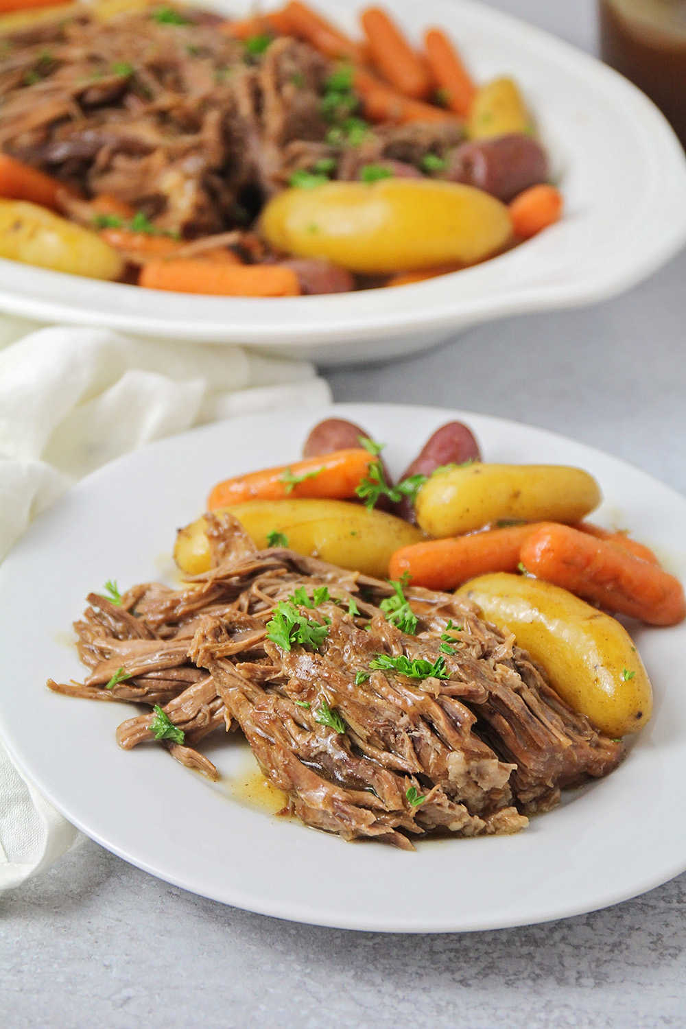 This tender and juicy Instant Pot pot roast is so easy to make, and so flavorful! It's a time-saving way to make a delicious roast!
