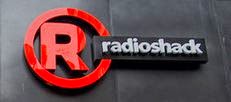 Image of a Radio Shack logo with a red capital R in a red circle with words radioshack next to it