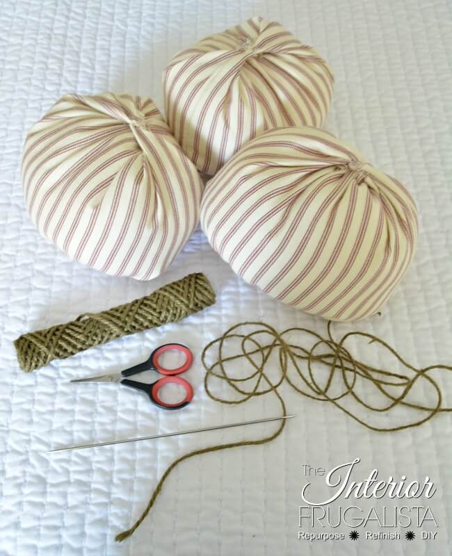 You'll need twine and an upholstery needle to make fabric pumpkin ribs and tendrils.