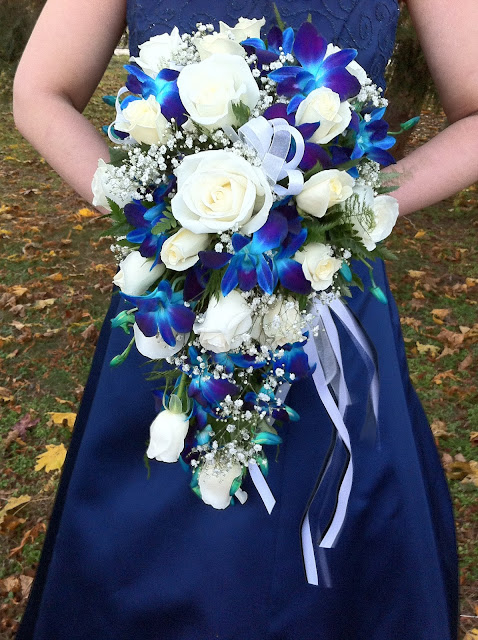 Blue orchid and white rose bridal cascade by Stein Your Florist Co.