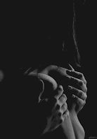 Black and white artistic gif of woman fondling breasts