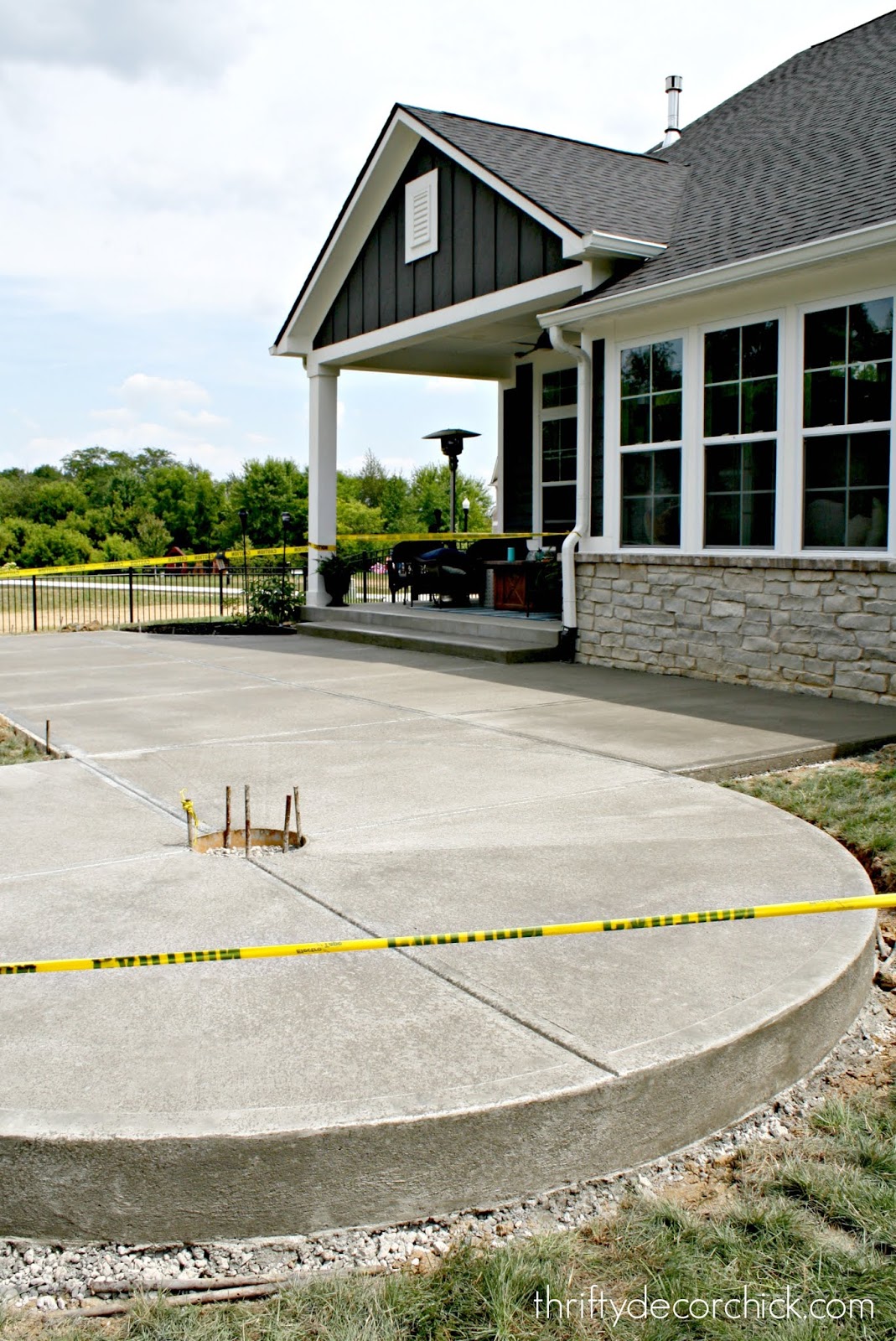 Concrete patio with round fire pit area