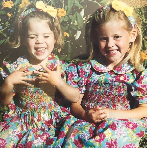 the princess and her younger sister, Eugenie, dressed up in floral-print dresses and matching hairbands