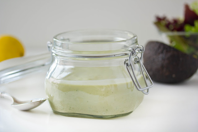 Avocado dressing a clear glass container