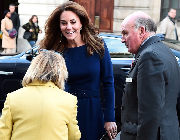 Kate Middleton wore Emilia Wickstead Kate a-line wool crepe dress in navy blue. Poppy Collection the first world war diamond brooch