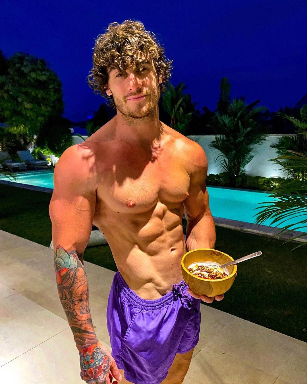 cute-curly-guys-owen-harrison-shirtless-muscular-body-perky-pecs-pointy-nips-eating-muesli