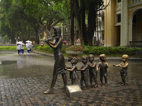 sculpture of children following a woman playing a violin in Guangzhou, China