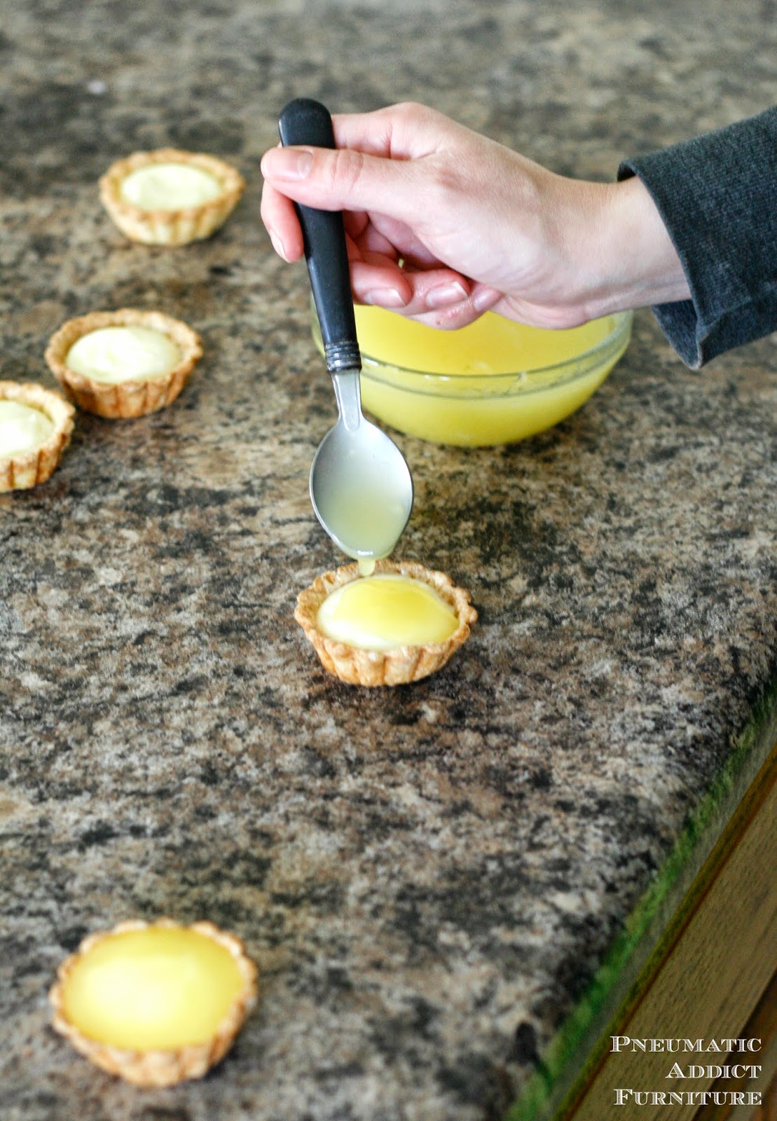 A flakey, buttery crust is the perfect base for two layers of lemon filling. 