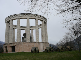 The Mausoleum housing Cesare Battisti's tomb stands on a rocky outcrop overlooking Trento