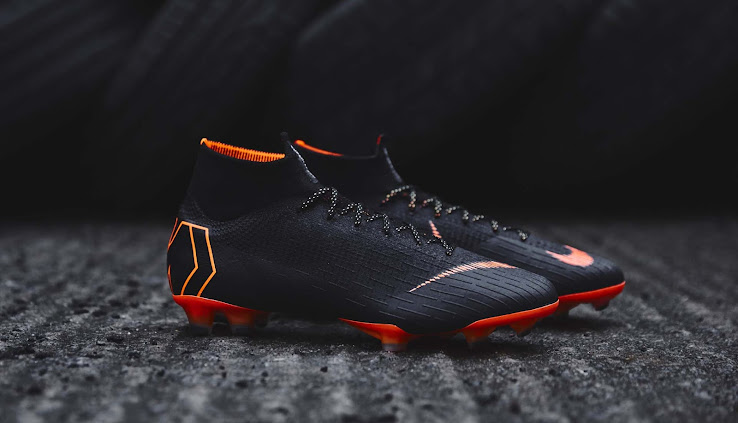 black and orange nike football boots