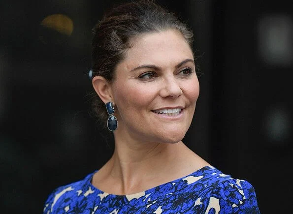 Crown Princess Victoria wore a floral dress by Rodebjer, and navy sandals by Saint Laurent, and blue diamond duchess earrings by Ebba Brahe