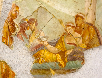 Yksityiskohta pitoja kuvaavasta freskosta Pompejista