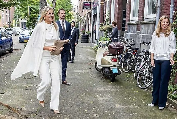 Queen Maxima wore Zara Sleeveless high-neck shirt. Maxima wore a sleeveless top by Zara. pearl earring and pearl brooch