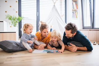 a family gathered reading a magazine