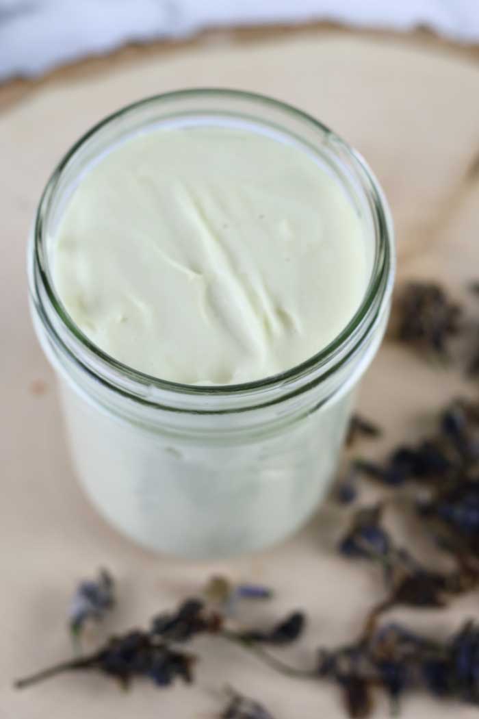 How to make a DIY after sun lotion. This recipe uses lilac infused carrier oils, aloe, and essential oils for the best moisturizer for summer.  This easy bath and body homemade recipe is great for after sun recovery. The oils have vitamin E for natural skin care. Summer beauty means taking care of your skin with natural products. #aftersun #aloe #diy #lotion