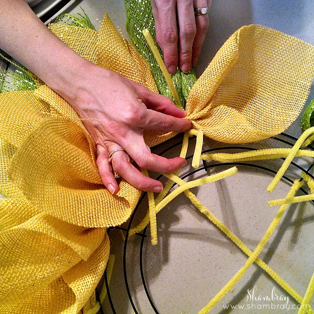 Wire wreath form, chenille stems, yellow burlap, deco mesh