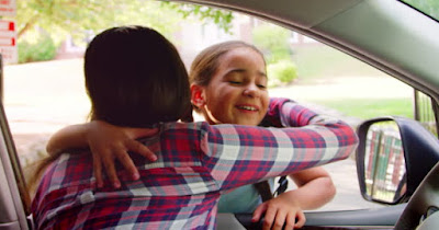 Mom dropping off daughter to daycare