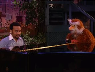 John Legend sings "It Feels Good When You Sing a Song" with Hoots the Owl. Sesame Street Episode 4324 Trashgiving Day season 43