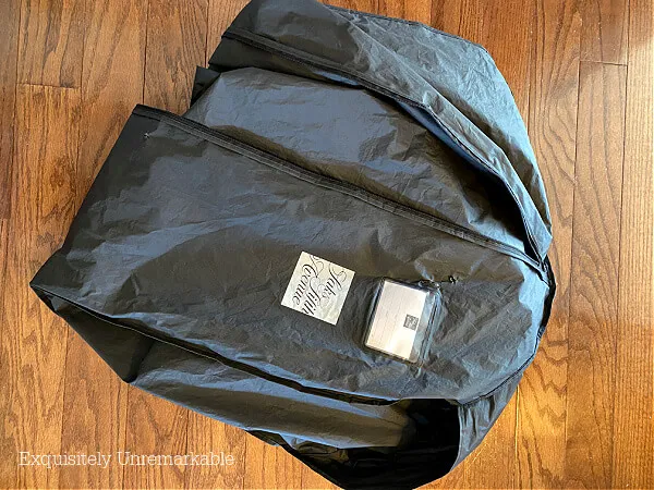 Black Dress Garment Bag On The Floor