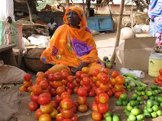 Selling vegetables for stew in Uganda