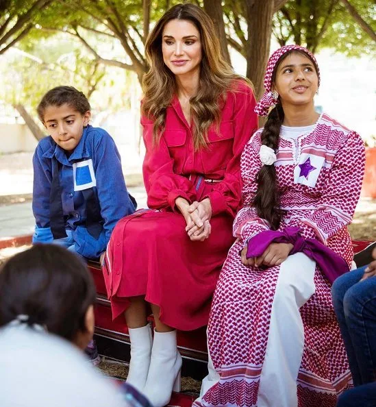 Queen Rania of Jordan visited Masahati Carnival organized by Madrasati initiative at Millennium Park in Amman. Queen wore red vintage belted shirt dress