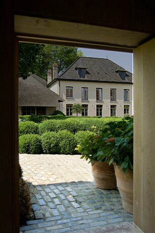 Garnier Antiques and Interior Architecture, historical residence and showroom "Vaucelleshof".  The 10 year renovation by Brigitte and Alain Garnier also includes event hall and catering facilities for rent. Image via the Garnier (be) website as seen on linenandlavender.net